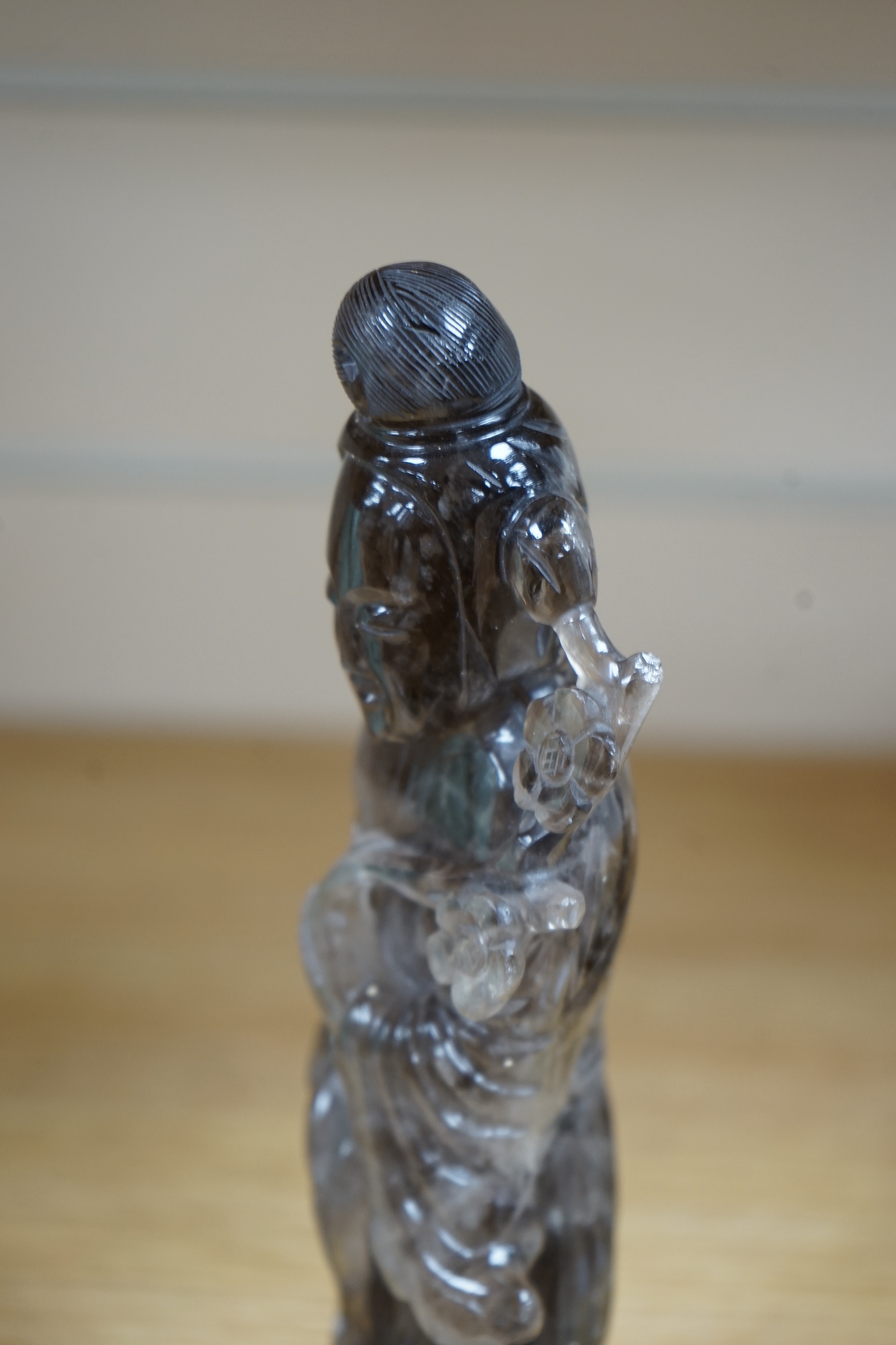 A Chinese smoky quartz figure of Guanyin, 23cm. Condition - fair to good